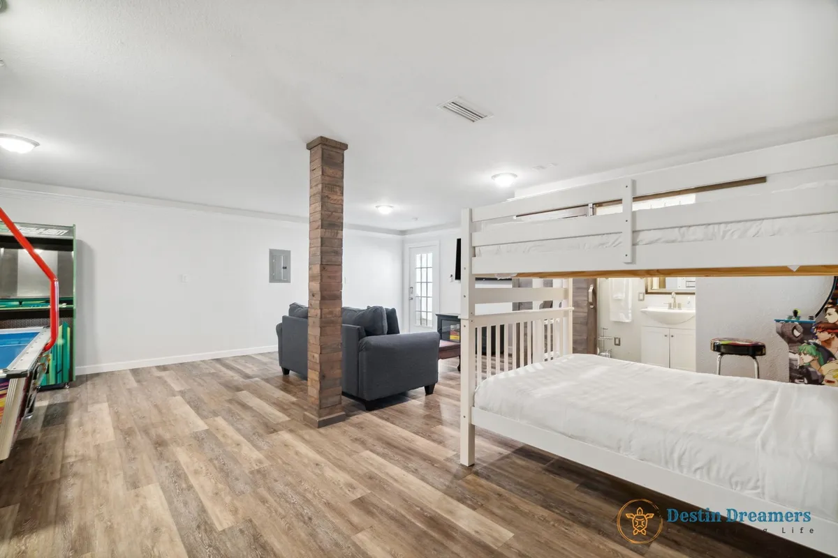 A cozy interior with built-in bunk beds, a comfortable seating area, and a designated games corner. The atmosphere is warm and family-friendly, ideal for games, relaxation, and bedtime storytelling.
